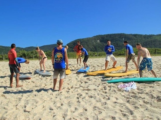 stretching surf'n'stay rio surf camp summer retreats for adults lessons children teen young adult best nomad kid bali canggu beginners uluwatu france moliets portugal algarve lisbon 2