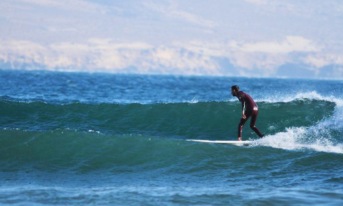 Surfer surfing a wave in Morocco