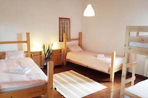 bedroom nomad surf camp - young adults 18 - 21 years old, algarve, portugal retreats for adults surf camp lessons children teen summer young adult best nomad kid bali canggu beginners uluwatu france moliets lisbon