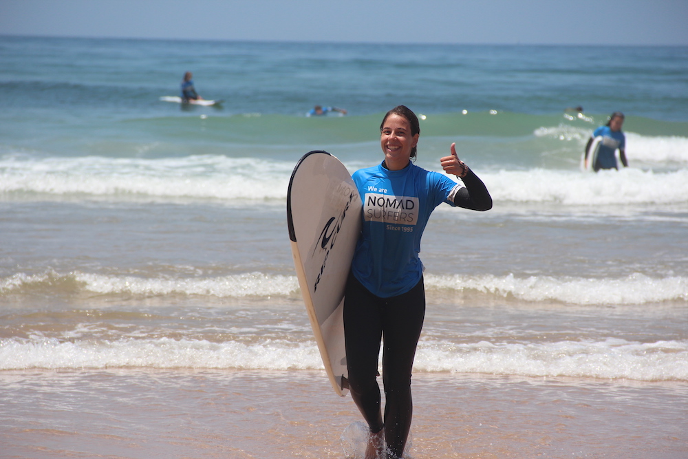 happy girl 3 nomad surf camp - young adults - lisbon - erasmus - university students retreats for adults surf camp lessons children teen summer young adult best nomad kid bali canggu beginners uluwatu france moliets portugal algarve