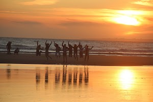 enjoy the sunset nomad surf camp - young adults - lisbon - erasmus - university students retreats for adults surf camp lessons children teen summer young adult best nomad kid bali canggu beginners uluwatu france moliets portugal algarve