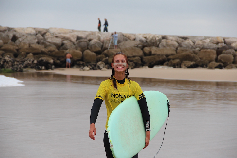 happy girl 11 nomad surf camp - young adults - lisbon - erasmus - university students retreats for adults surf camp lessons children teen summer young adult best nomad kid bali canggu beginners uluwatu france moliets portugal algarve