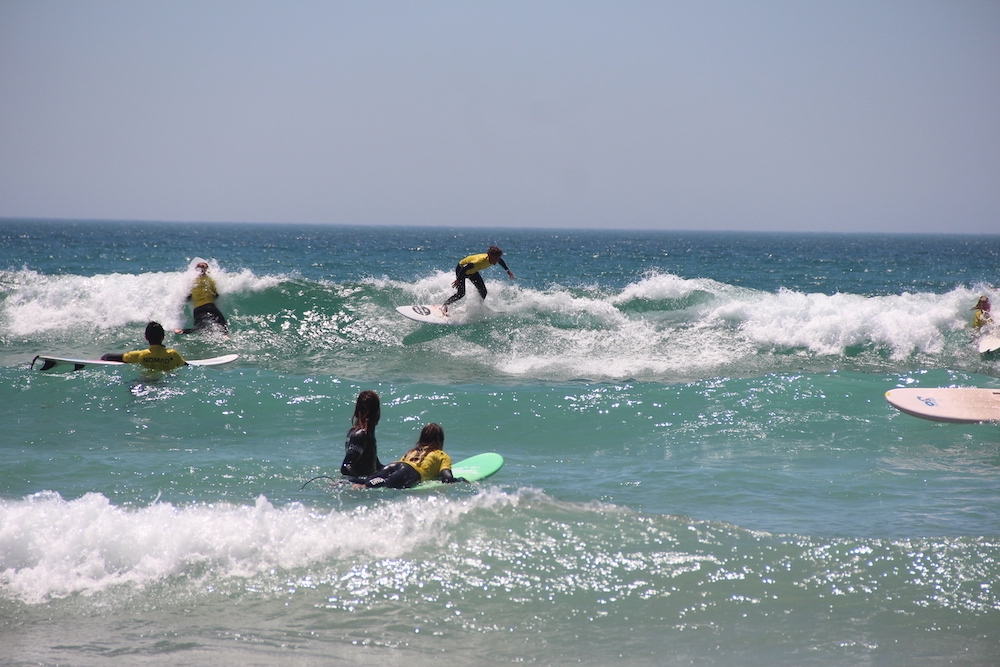 surfing nomad surf camp - young adults - lisbon - erasmus - university students retreats for adults surf camp lessons children teen summer young adult best nomad kid bali canggu beginners uluwatu france moliets portugal algarve