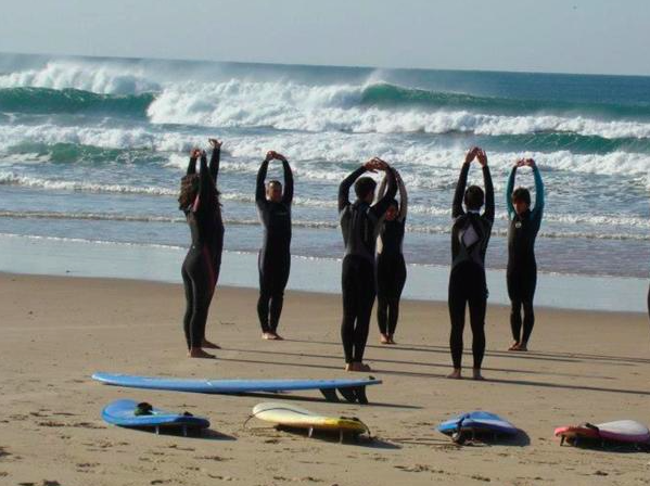 surf stretching nomad surf camp - young adults - lisbon - erasmus - university students retreats for adults surf camp lessons children teen summer young adult best nomad kid bali canggu beginners uluwatu france moliets portugal algarve