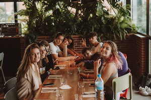 dinner together nomad surf camp - young adults - cantabria retreats for adults surf camp lessons summer young adult best nomad kid bali canggu beginners uluwatu france moliets portugal algarve lisbon