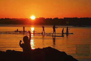 sunset paddle nomad surf camp - young adults - cantabria retreats for adults surf camp lessons summer young adult best nomad kid bali canggu beginners uluwatu france moliets portugal algarve lisbon
