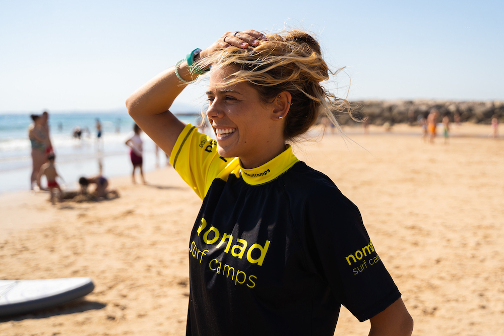 happy girl 9 nomad surf camp - young adults - lisbon - erasmus - university students retreats for adults surf camp lessons children teen summer young adult best nomad kid bali canggu beginners uluwatu france moliets portugal algarve