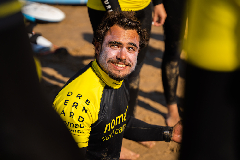 men surf stretching nomad surf camp - young adults - lisbon - erasmus - university students retreats for adults surf camp lessons children teen summer young adult best nomad kid bali canggu beginners uluwatu france moliets portugal algarve